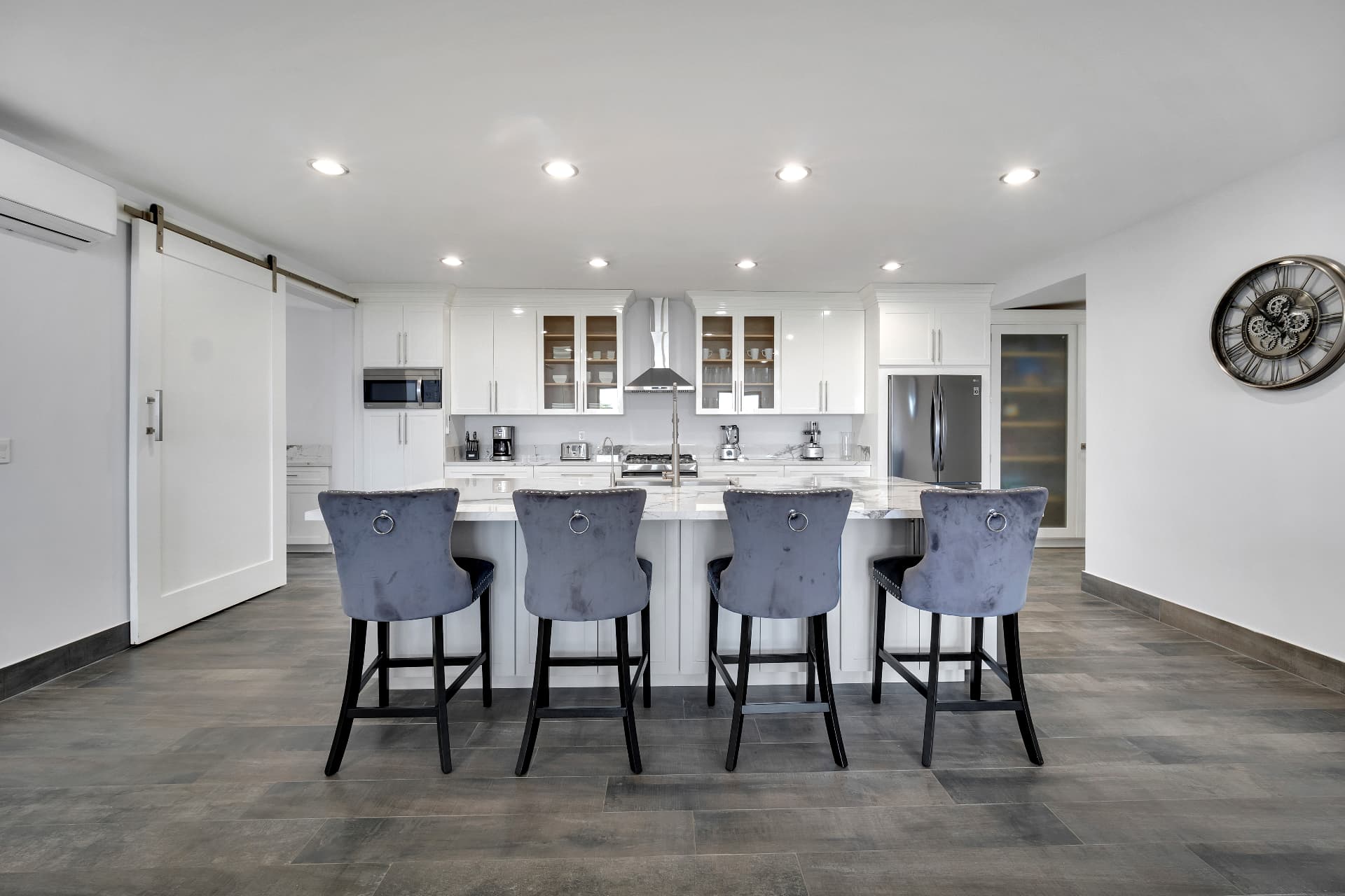 Chef's kitchen island with velvet bar stools